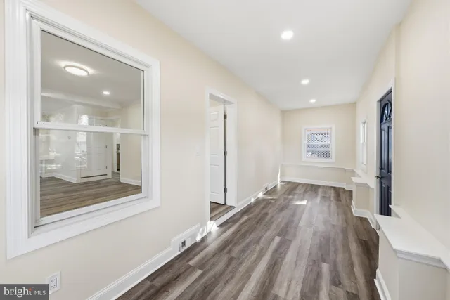 a view of livingroom with hardwood floor and hallway