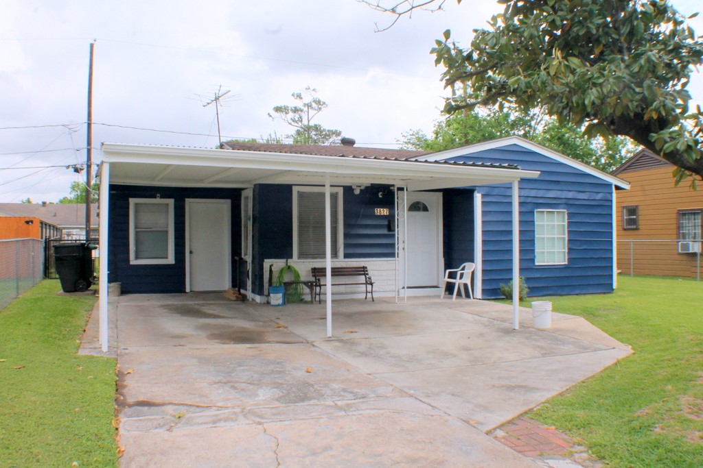 a view of a house with a porch and furniture