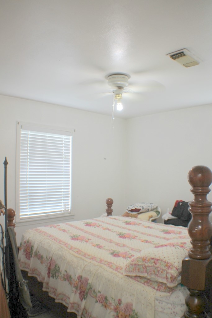 3827 Landa Lane Houston, TX 77023 - Photo 17 of 23 a bedroom with a bed and a window