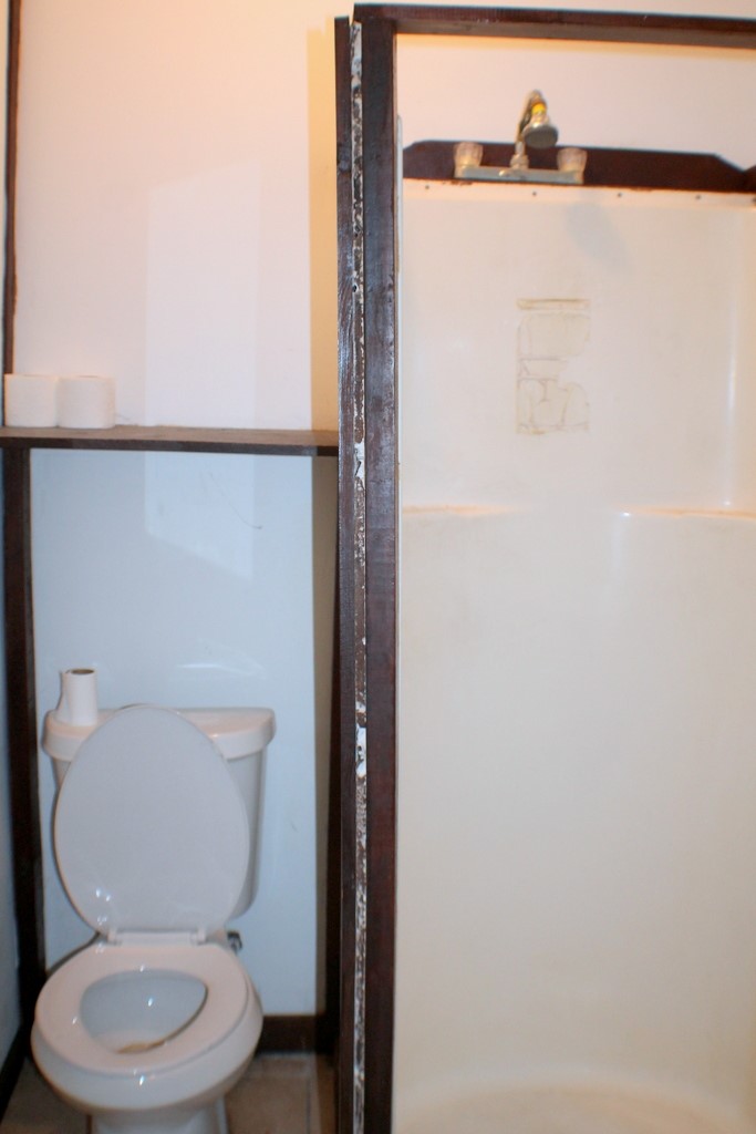 3827 Landa Lane Houston, TX 77023 - Photo 21 of 23 a white toilet sitting next to a shower