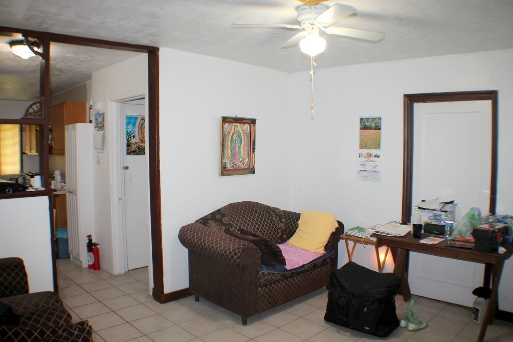 3827 Landa Lane Houston, TX 77023 - Photo 7 of 23 a living room with furniture and a chandelier