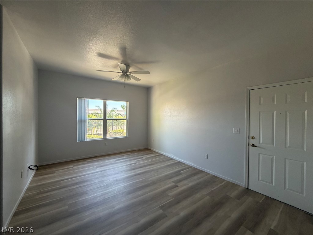 7255 West Sunset Road, Unit 1158 Las Vegas, NV 89113 - Photo 6 of 10 A versatile living space with light wood-look flooring and abundant natural light.