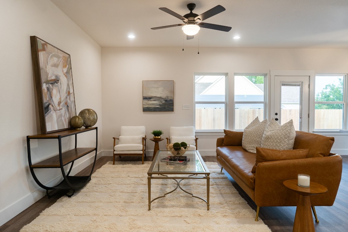 304 String Prairie Way Smithville, TX 78957 - Photo 12 of 30 Living room featuring baseboards, wood finished floors, a ceiling fan, and recessed lighting