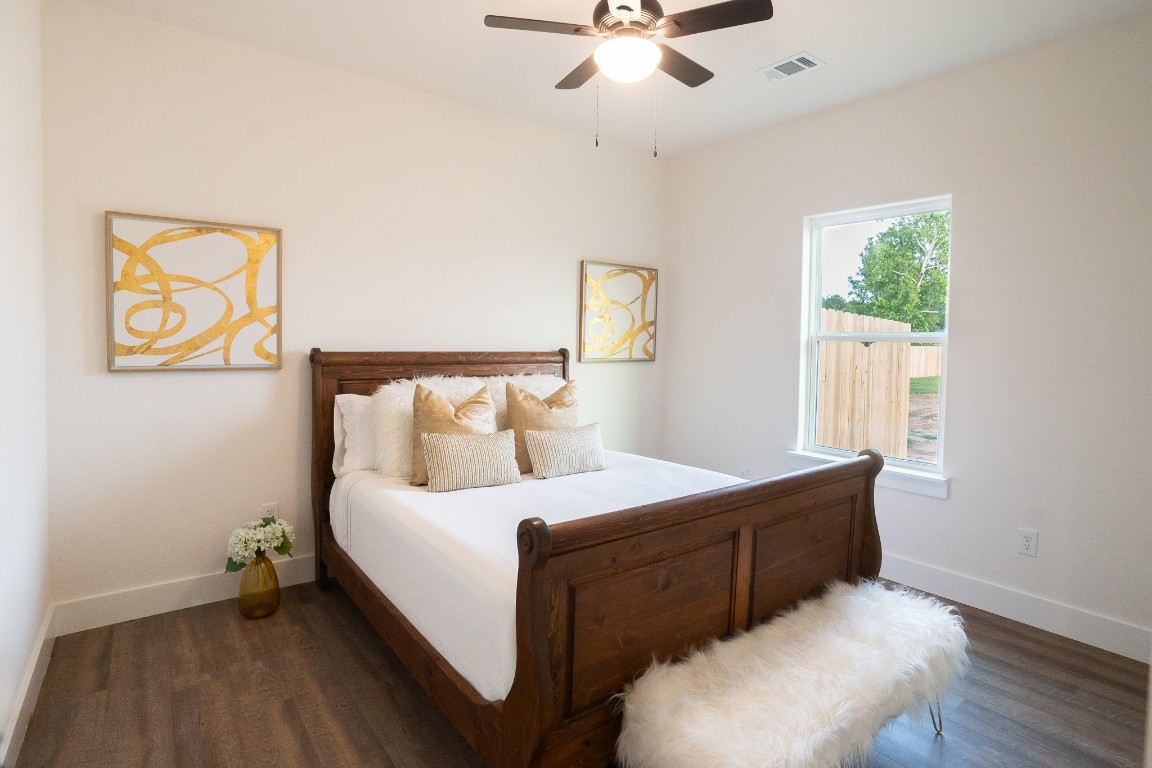 304 String Prairie Way Smithville, TX 78957 - Photo 24 of 30 Bedroom with dark wood-style floors, baseboards, and ceiling fan