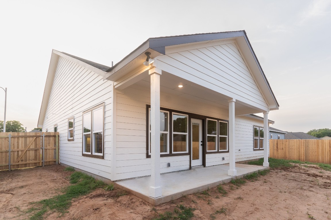 304 String Prairie Way Smithville, TX 78957 - Photo 27 of 30 Back of property featuring a fenced backyard and a patio area