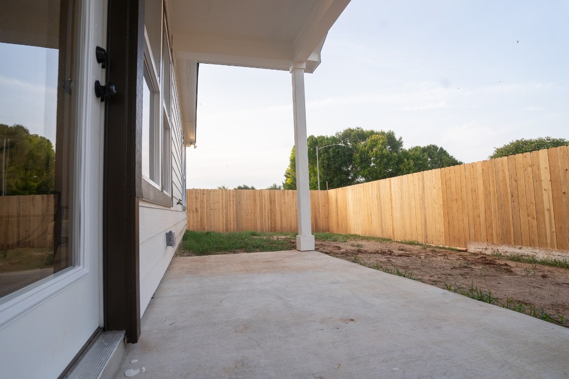 304 String Prairie Way Smithville, TX 78957 - Photo 28 of 30 Fenced backyard featuring a patio area