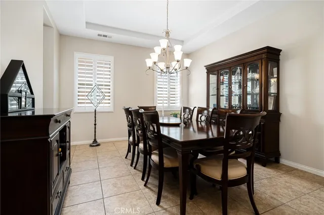 a view of a a dining room with furniture and window