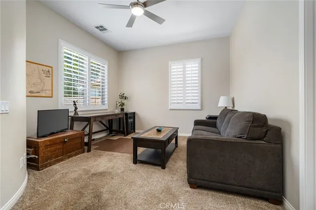 a room with gym equipment and windows