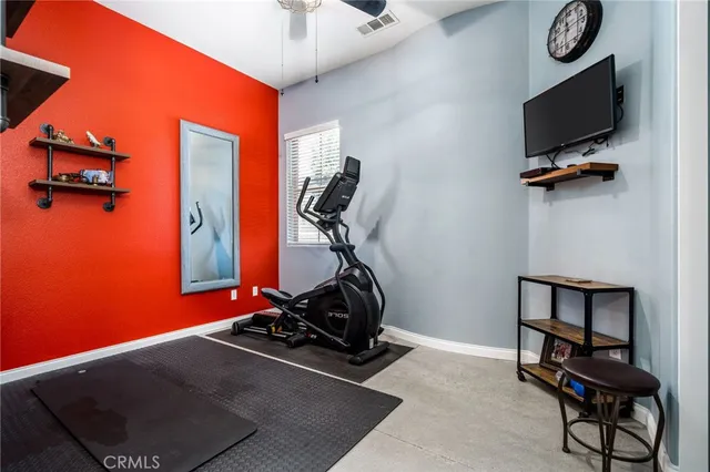 a bed sitting in a room next to a window