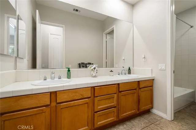 a close view of a sink and mirror in a bathroom