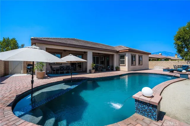 a view of a swimming pool with a patio