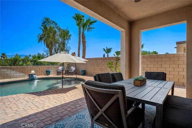 a view of a dining room with furniture and windows