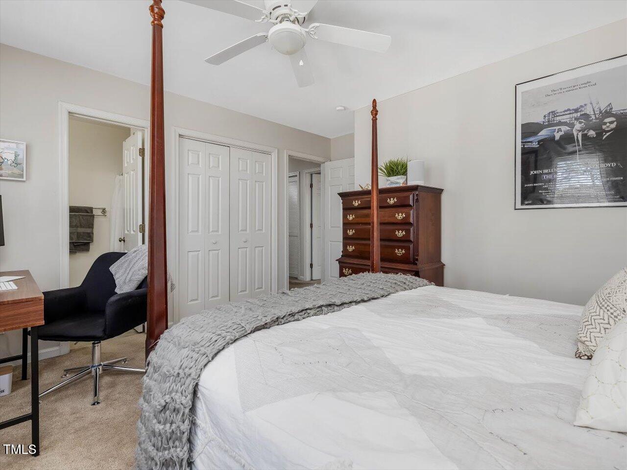 1328 Baez Street Raleigh, NC 27608 - Photo 22 of 32 a bedroom with a bed and a chandelier