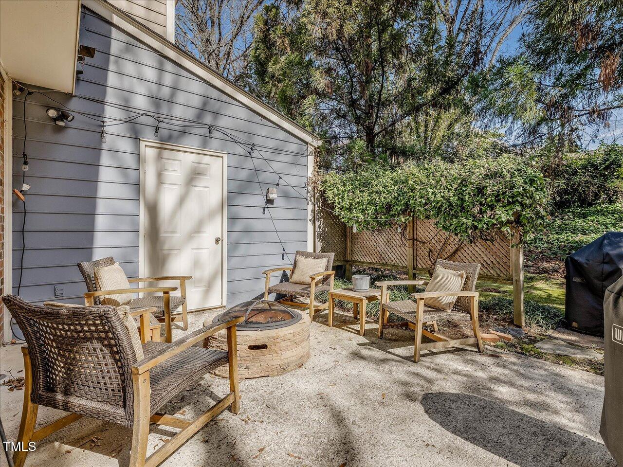 1328 Baez Street Raleigh, NC 27608 - Photo 26 of 32 a view of backyard with outdoor seating and trees