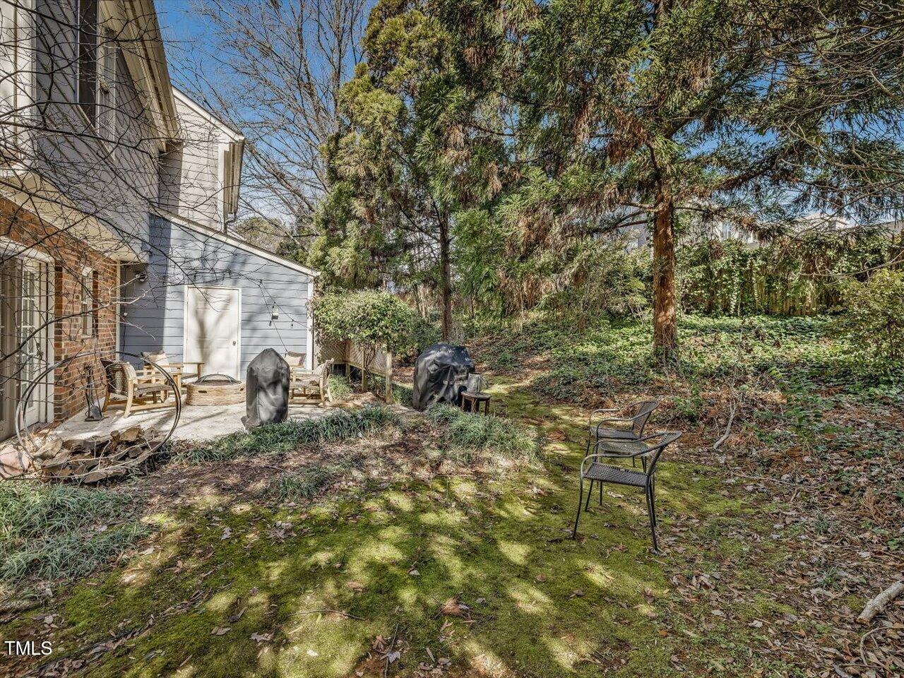 1328 Baez Street Raleigh, NC 27608 - Photo 30 of 32 a backyard of a house with table and chairs