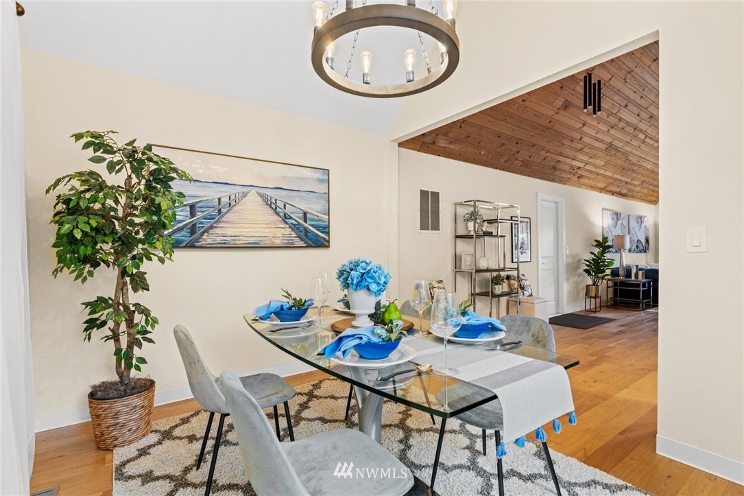 11639 Fay Road Northeast Carnation, WA 98014 - Photo 14 of 40 a view of a dining room with furniture and wooden floor