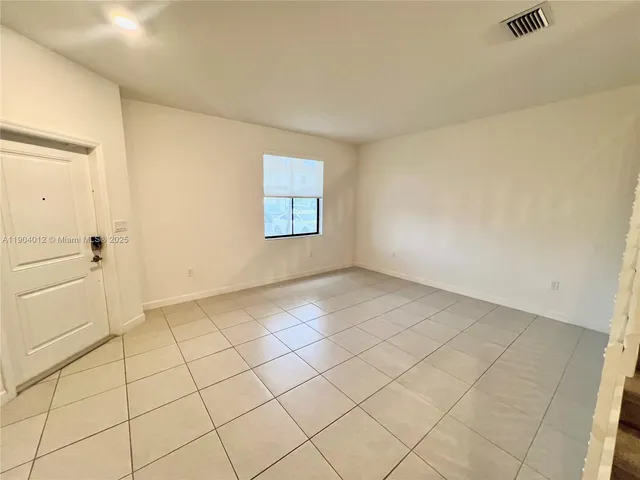 a view of an empty room and window