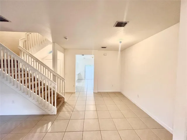 a view of an entryway with a white wall