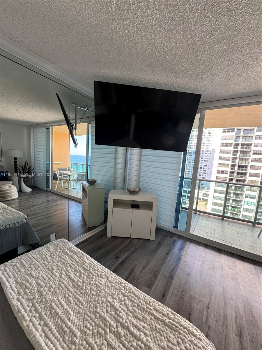 2501 South Ocean Drive, Unit 1105 Hollywood, FL 33019 - Photo 11 of 45 a living room with furniture and a flat screen tv