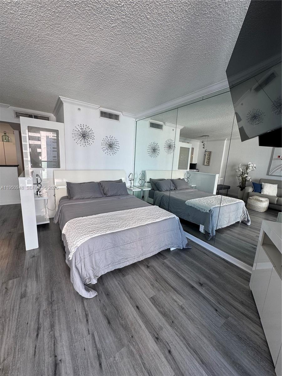 2501 South Ocean Drive, Unit 1105 Hollywood, FL 33019 - Photo 12 of 45 a spacious bedroom with two beds and a couch