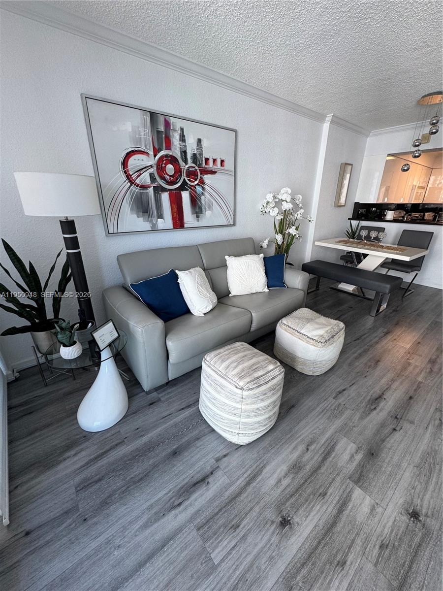 2501 South Ocean Drive, Unit 1105 Hollywood, FL 33019 - Photo 13 of 45 a living room with furniture and wooden floor