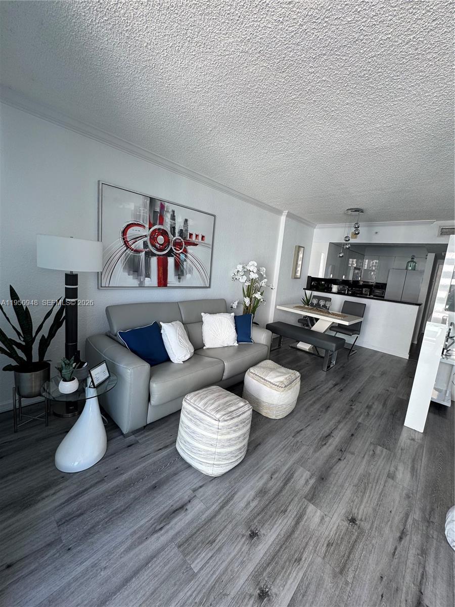 2501 South Ocean Drive, Unit 1105 Hollywood, FL 33019 - Photo 14 of 45 a living room with furniture and wooden floor