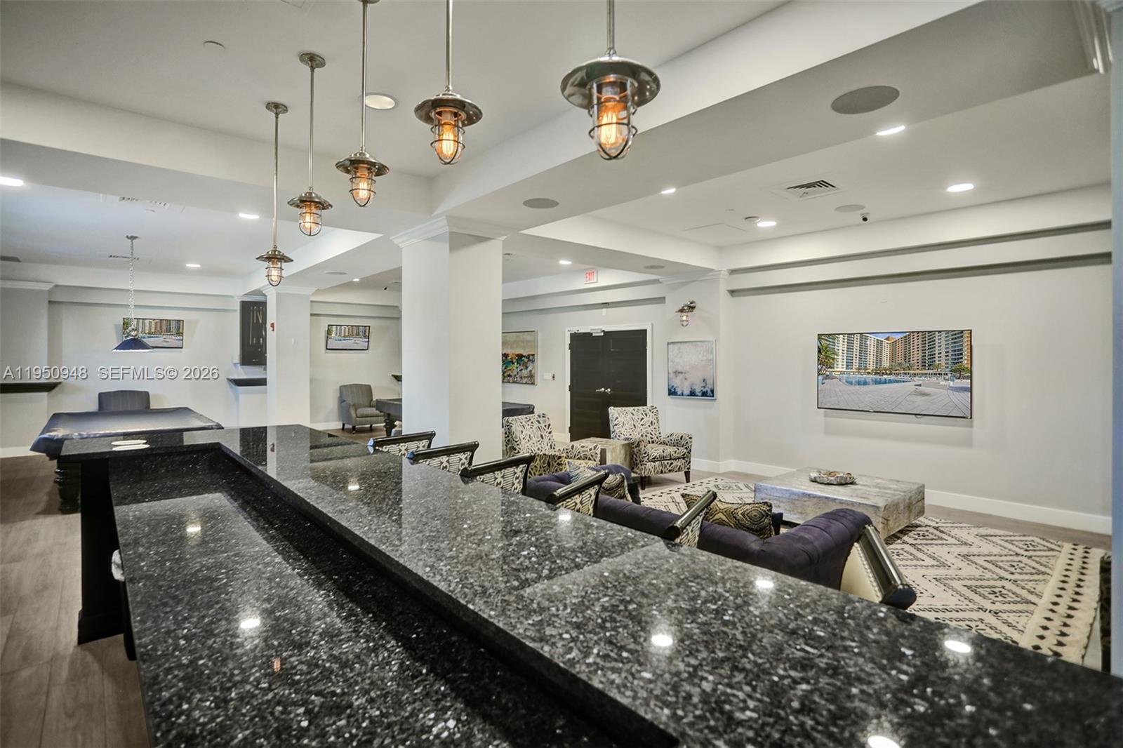 2501 South Ocean Drive, Unit 1105 Hollywood, FL 33019 - Photo 17 of 45 a living room with lots of furniture and a wooden floor