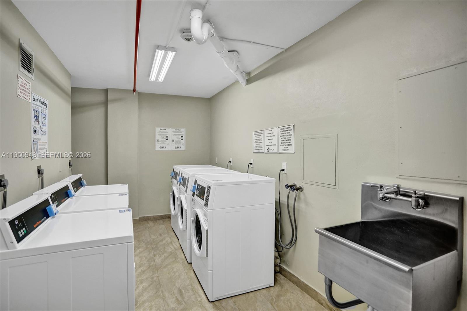 2501 South Ocean Drive, Unit 1105 Hollywood, FL 33019 - Photo 19 of 45 a utility room with dryer and washer