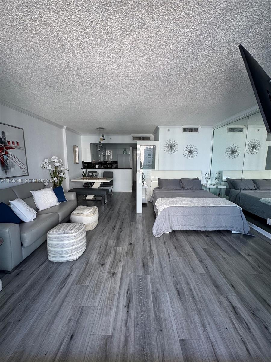 2501 South Ocean Drive, Unit 1105 Hollywood, FL 33019 - Photo 2 of 45 a living room with furniture and a wooden floor