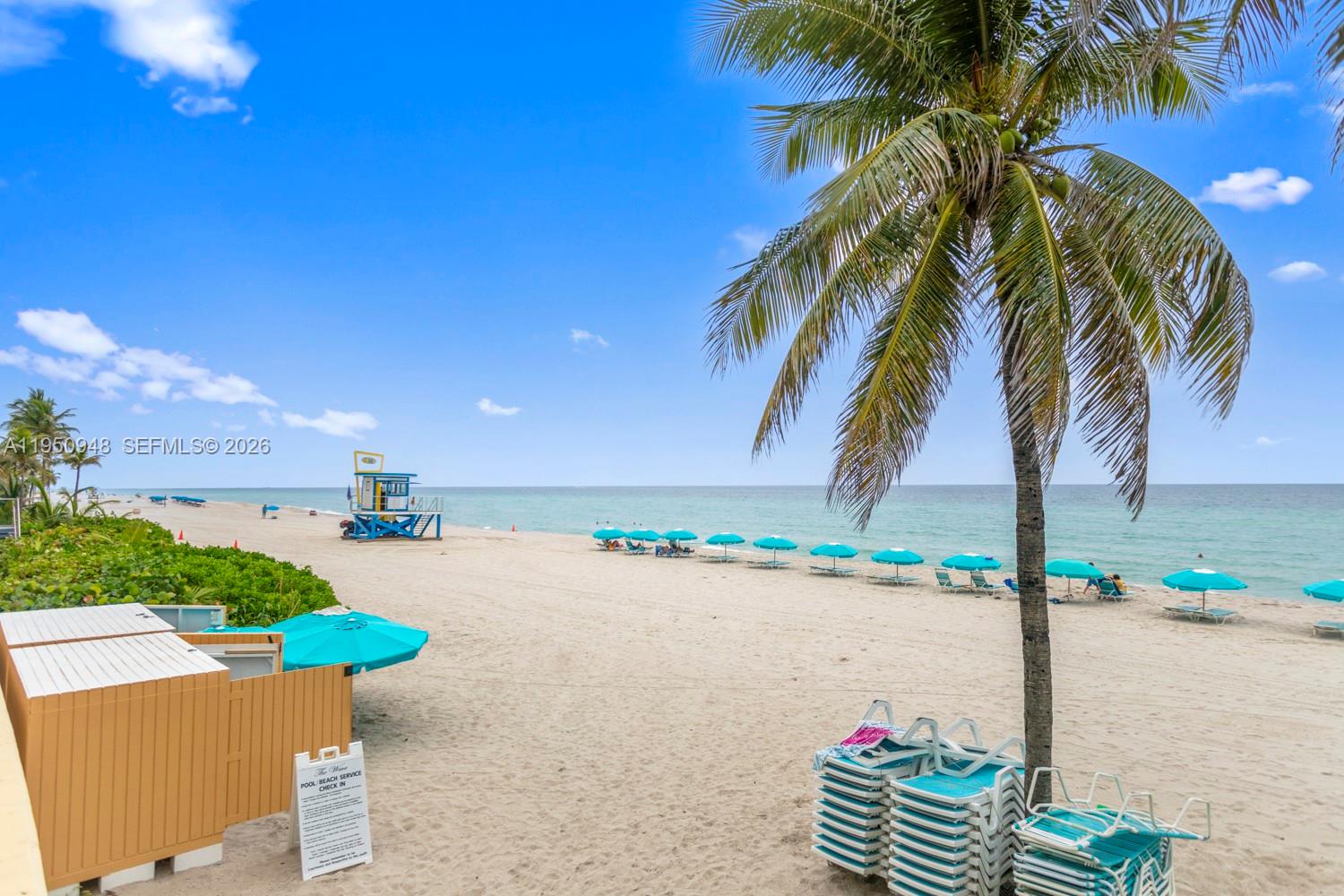 2501 South Ocean Drive, Unit 1105 Hollywood, FL 33019 - Photo 28 of 45 a patio with table and chairs and potted plants
