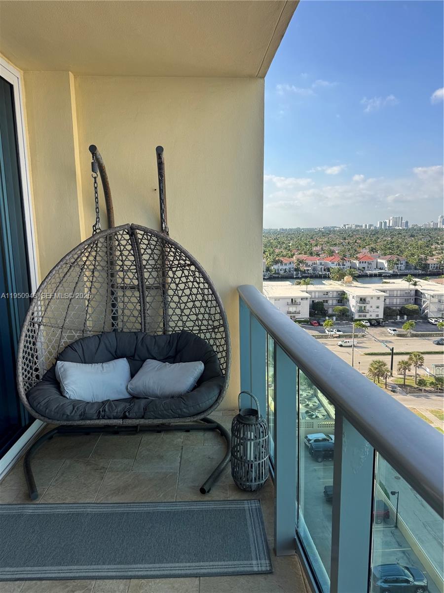 2501 South Ocean Drive, Unit 1105 Hollywood, FL 33019 - Photo 3 of 45 a balcony with furniture and a floor to ceiling window