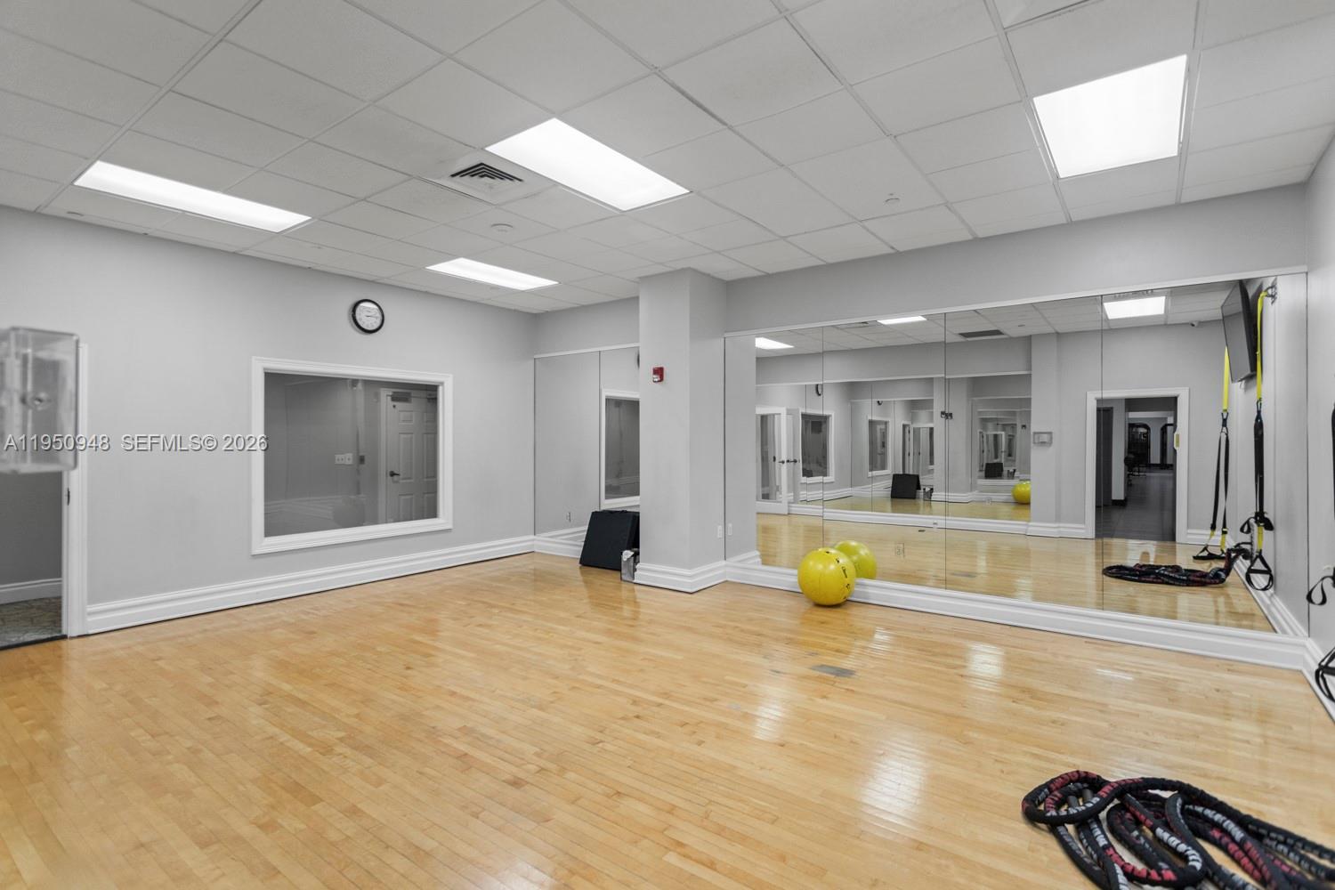2501 South Ocean Drive, Unit 1105 Hollywood, FL 33019 - Photo 33 of 45 a view of an empty room with wooden floor and a flat screen tv