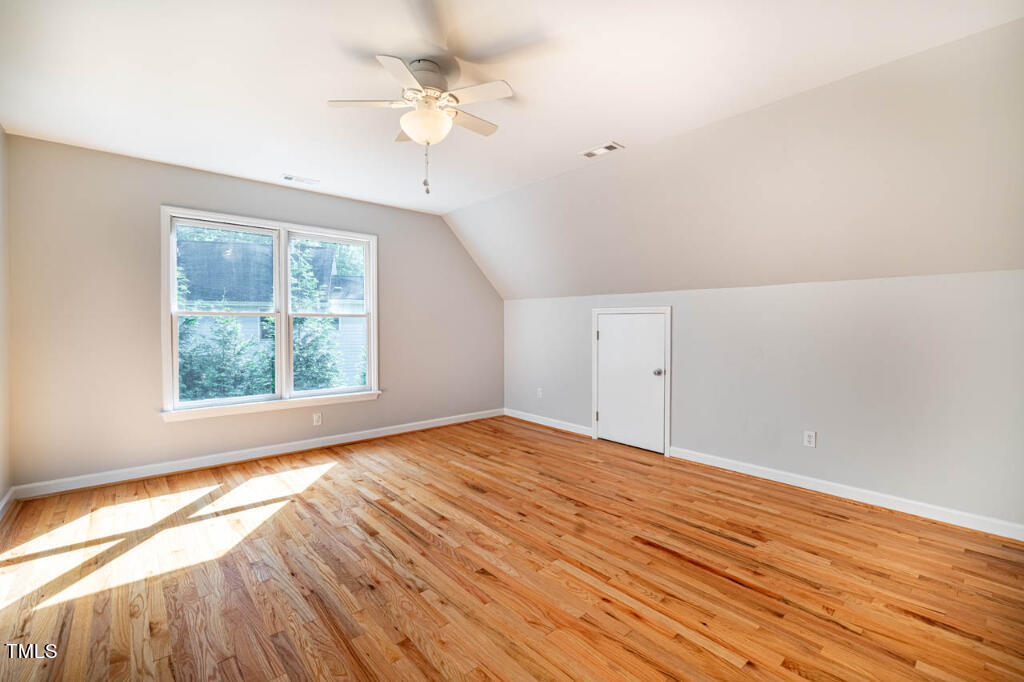 608 Manor Ridge Road Carrboro, NC 27510 - Photo 60 of 70 an empty room with wooden floor and windows