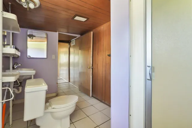 a bathroom with a sink a toilet and bathtub