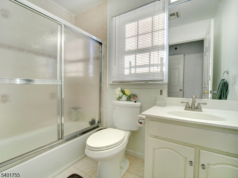 415 Loomis Street Elizabeth Port, NJ 07206 - Photo 13 of 27 a bathroom with a sink a toilet and shower