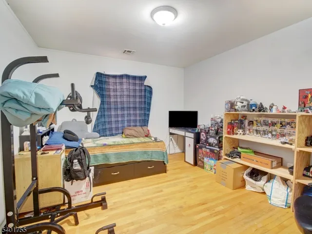 a room with gym equipment and a flat screen tv