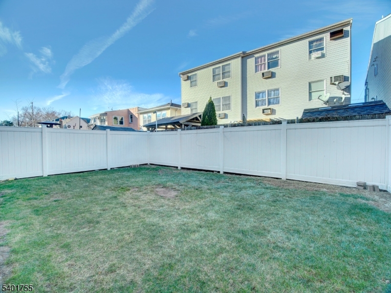 415 Loomis Street Elizabeth Port, NJ 07206 - Photo 26 of 27 a backyard of a house with lots of green space