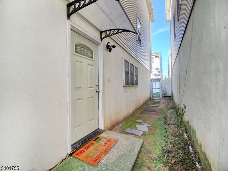 415 Loomis Street Elizabeth Port, NJ 07206 - Photo 27 of 27 a bathroom with a sink and a mirror
