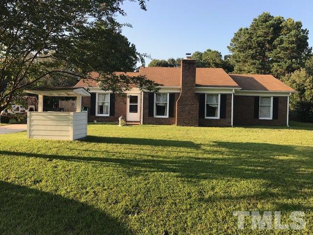 809 South Meadow Road Raleigh, NC 27603 - Photo 1 of 14 a front view of a house with a garden