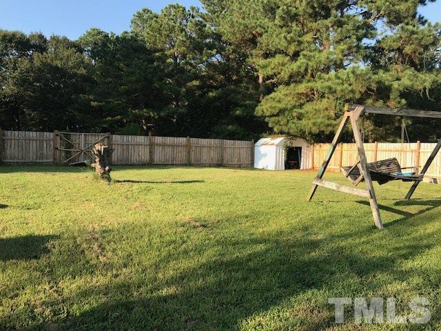 809 South Meadow Road Raleigh, NC 27603 - Photo 3 of 14 a view of a swimming pool with a yard