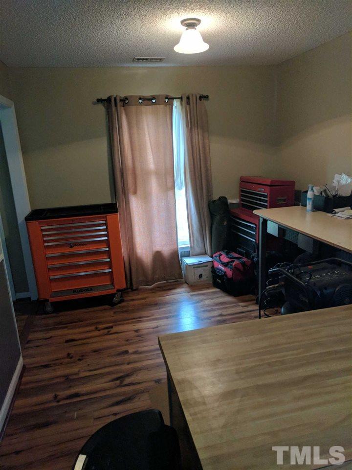 809 South Meadow Road Raleigh, NC 27603 - Photo 7 of 14 a view of room with wooden floor