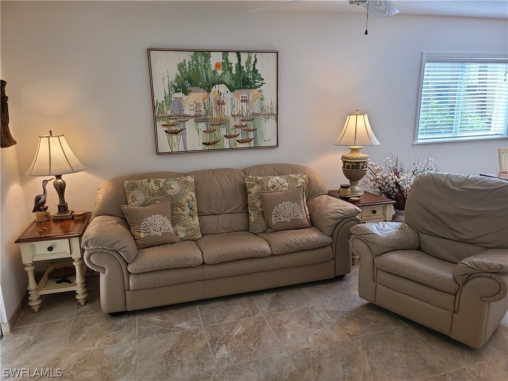 8071 Country Road, Unit 102 Fort Myers, FL 33919 - Photo 3 of 20 a living room with furniture and a window