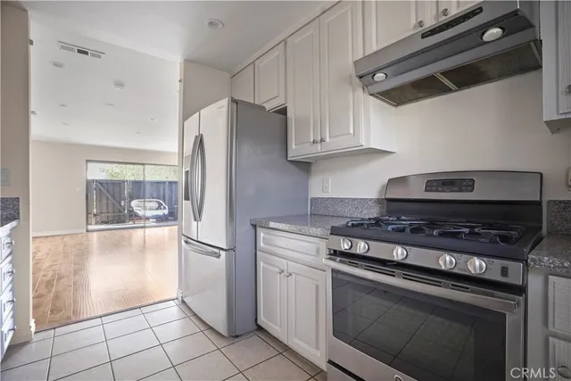 a kitchen with appliances and cabinets