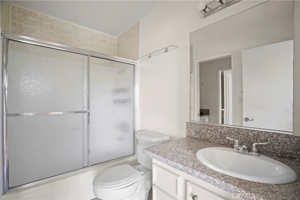 11311 Tampa Avenue, Unit 21 Porter Ranch, CA 91326 - Photo 19 of 36 a bathroom with a sink toilet and shower