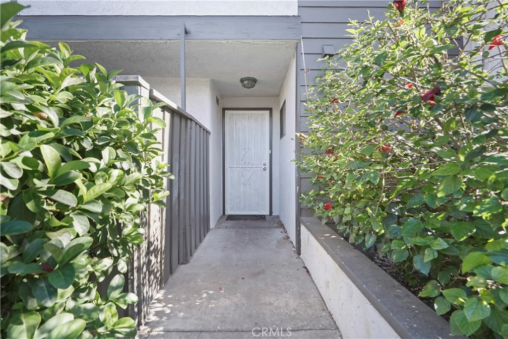 11311 Tampa Avenue, Unit 21 Porter Ranch, CA 91326 - Photo 2 of 36 a picture of a yard with plants