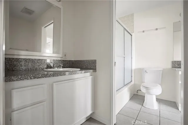 a view of hallway with stairs and wooden floor