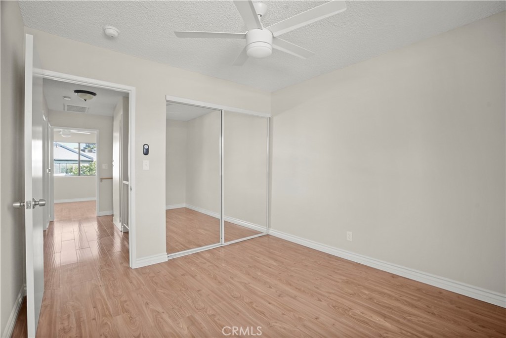 11311 Tampa Avenue, Unit 21 Porter Ranch, CA 91326 - Photo 29 of 36 wooden floor in an empty room with a window