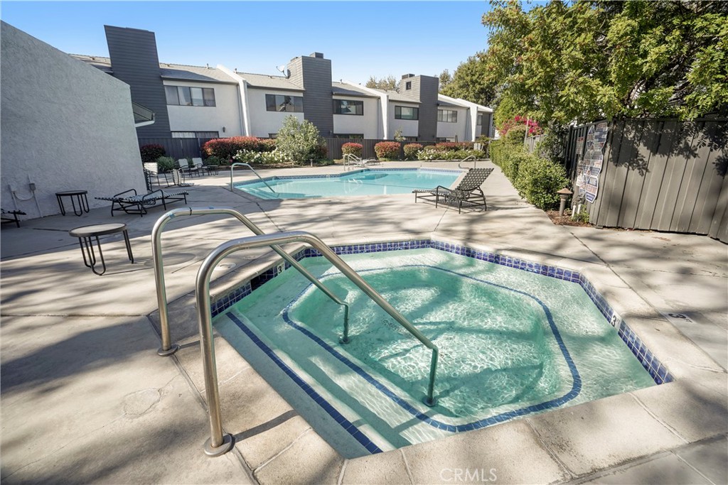 11311 Tampa Avenue, Unit 21 Porter Ranch, CA 91326 - Photo 32 of 36 a view of swimming pool from a lounge chair