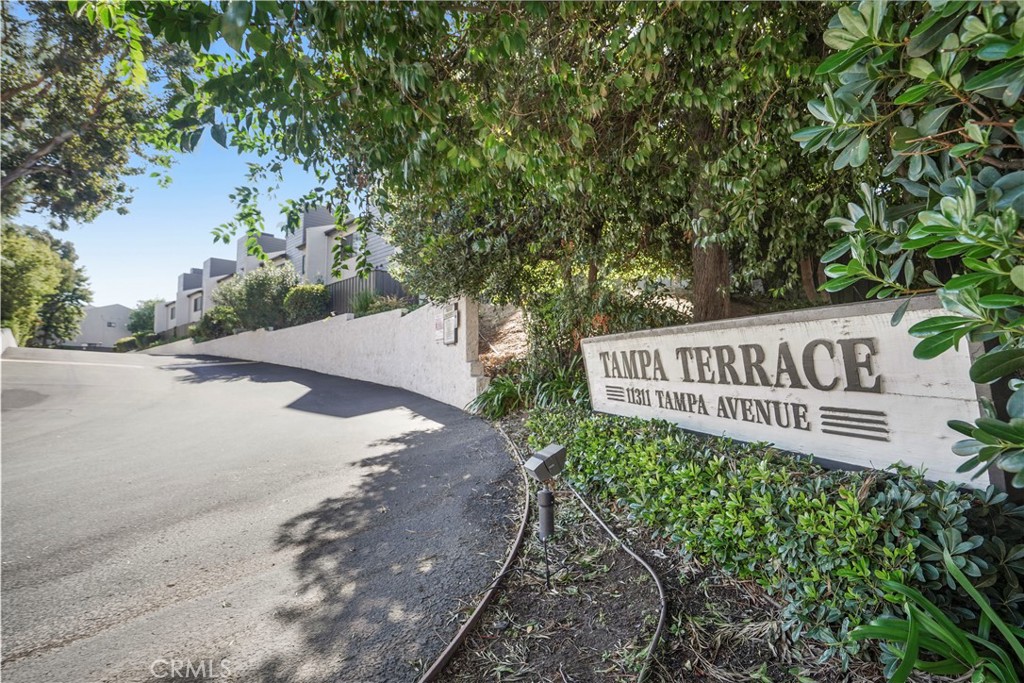 11311 Tampa Avenue, Unit 21 Porter Ranch, CA 91326 - Photo 36 of 36 a view of a sign board with yard and tree