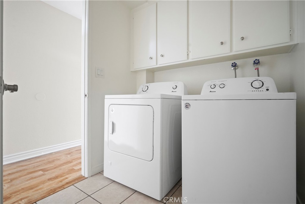 11311 Tampa Avenue, Unit 21 Porter Ranch, CA 91326 - Photo 5 of 36 a utility room with dryer and washer